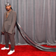 Guapdad 4000 sported a lurex du-rag with a 10-foot train at the 2020 Grammy Awards.